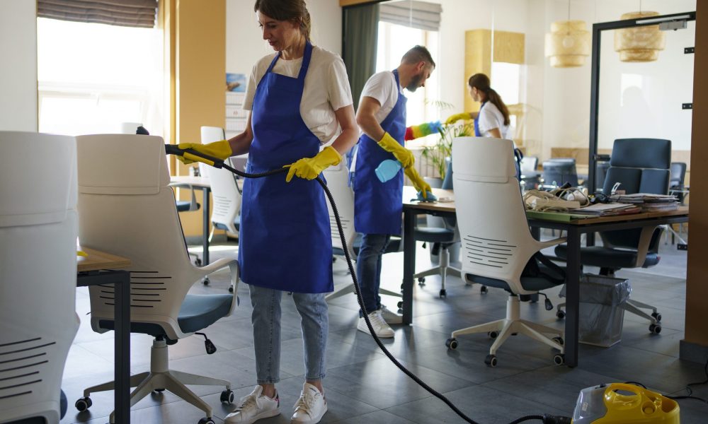 professional-cleaning-service-person-using-vacuum-cleaner-office